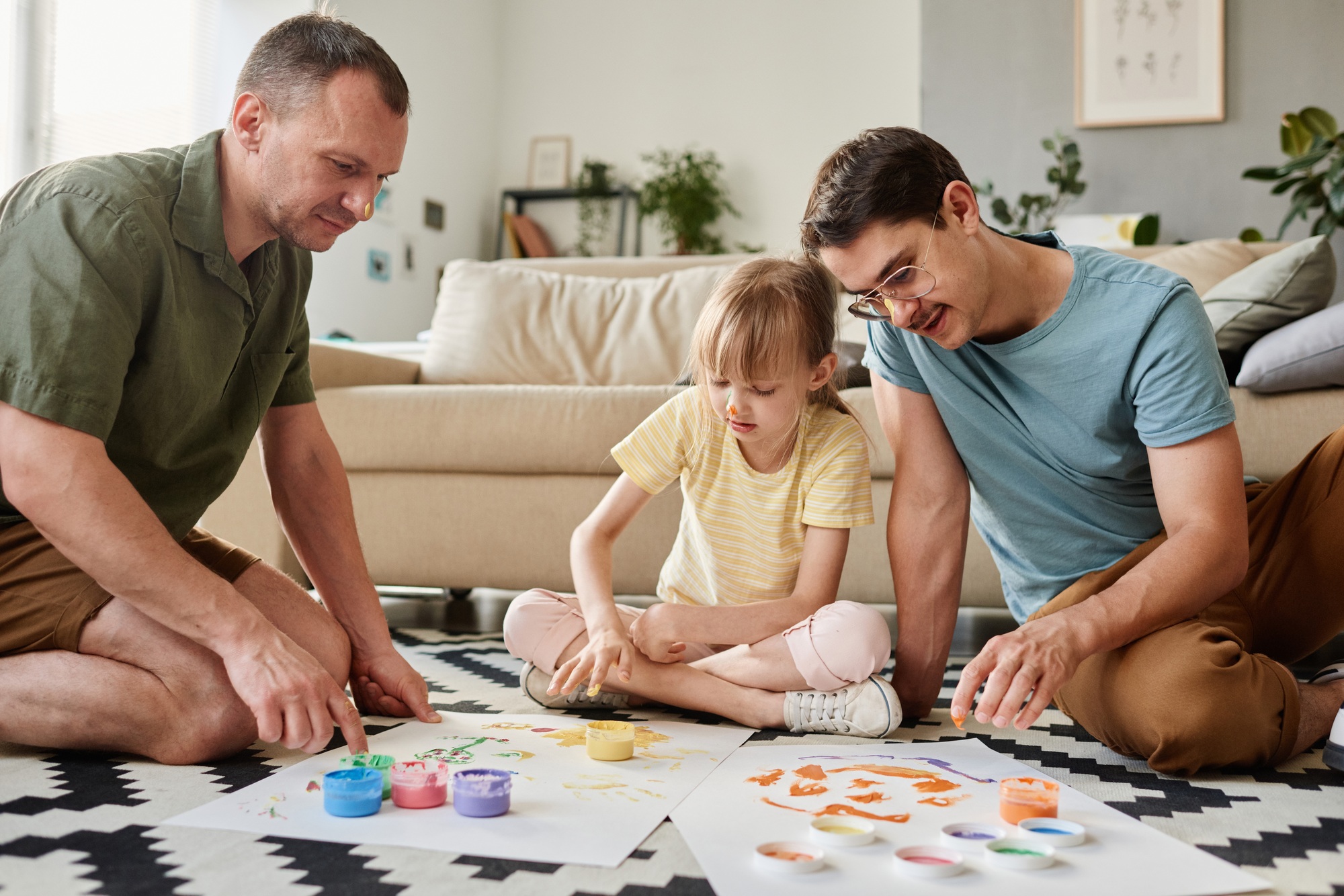 Family painting together at home